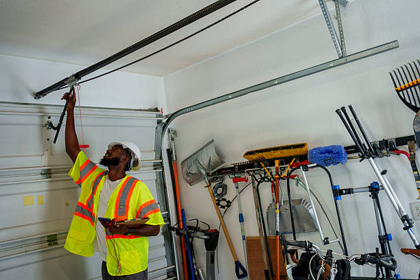 Professional Garage Door Panel Replacement technician working in Arkansas City, KS